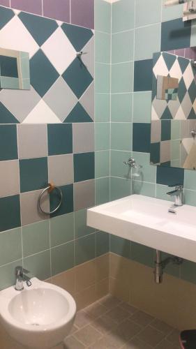 a bathroom with a sink and a toilet at Il Viandante in Recanati