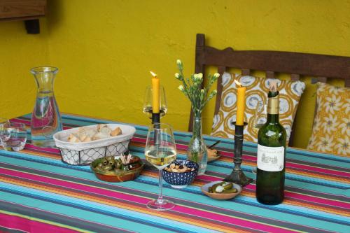 a table with two bottles of wine and wine glasses at MaDamenFrance in Monclar-dʼAgenais
