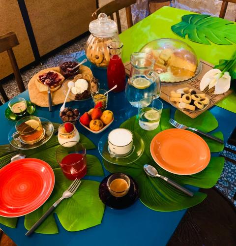 a table with plates of food on top at La Vecchia Posta B&B in Calangianus