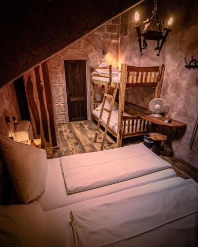 a bedroom with two bunk beds and a desk at Vaya Casa in Kappelrodeck