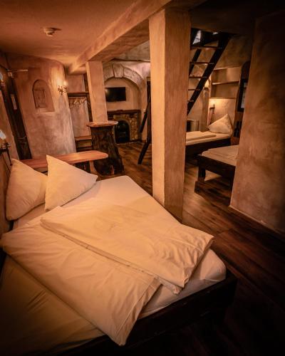 a bedroom with a bed in a room with stairs at Vaya Casa in Kappelrodeck