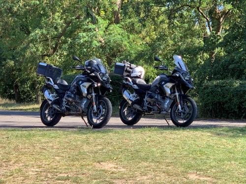 two motorcycles parked next to each other on a road at CHAPEAUVEAU Gîte - b&b - Events in Helecine