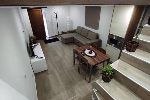 an overhead view of a living room with a table and a couch at Casinha da Fonte in Lamas de Podence