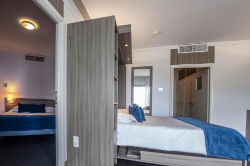 Ένα ή περισσότερα κρεβάτια σε δωμάτιο στο Suite Home Porticcio