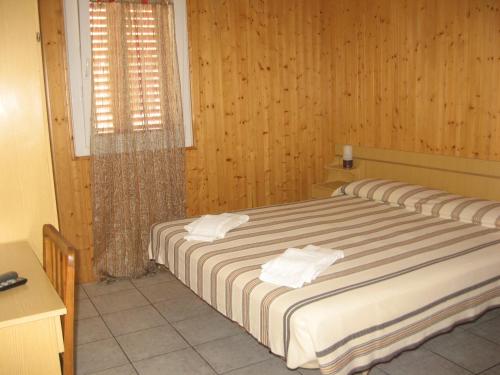 Кровать или кровати в номере Hotel Eleonora