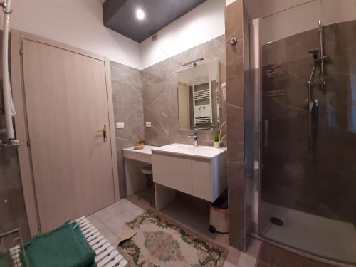 a bathroom with a sink and a shower at Stella del Mare in Sottomarina