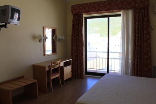 Cama o camas de una habitación en Hotel Da Nazare