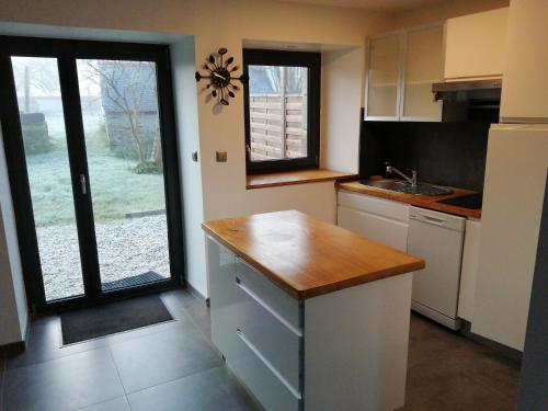 a kitchen with a sink and a counter top at Les Mouettes in Plouër-sur-Rance