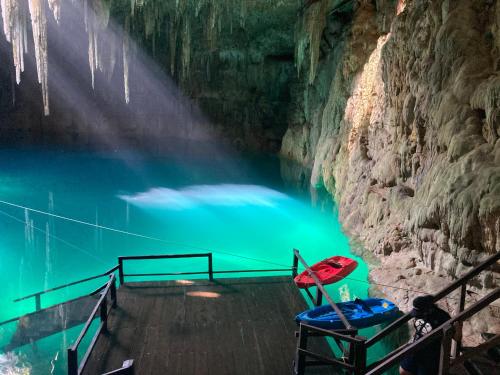 a chair next to a body of water at Hotel Casa San Juan in Valladolid