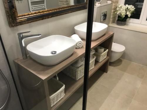 a bathroom with a sink and a mirror at Central Park Residence in Split