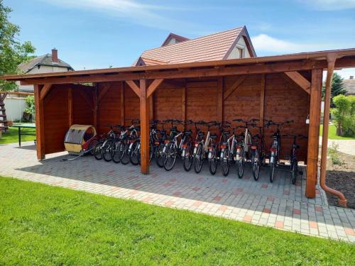 a garage with a bunch of bikes parked in it at Kertész Vendégház in Hegykő
