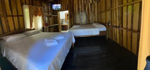 Un pat sau paturi într-o cameră la Finca Avellanas