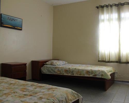 Säng eller sängar i ett rum på Apartamento de frente para o Mar em Luís Correia