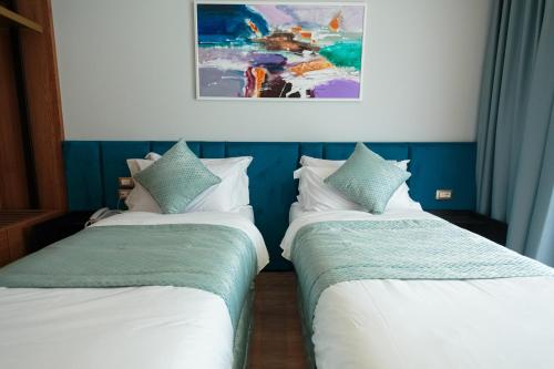 Postel nebo postele na pokoji v ubytování Ames Hotel & SPA