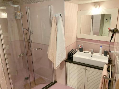 a bathroom with a shower and a sink at Lovely Home Marta in Pozzuoli