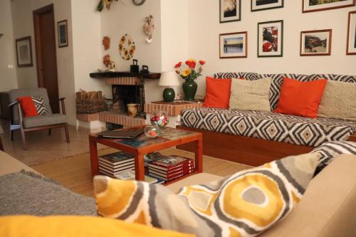 a living room with two couches and a table at Cà 'd Langa B&B in Treiso