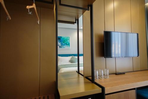 TV a/nebo společenská místnost v ubytování Ames Hotel & SPA