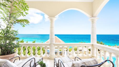 a view of the ocean from the balcony of a villa at Sandcastle Villa in Crocus Hill