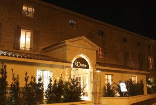 a building with a sign on the front of it at Hotel Restaurant Chartron in Saint-Donat-sur-lʼHerbasse