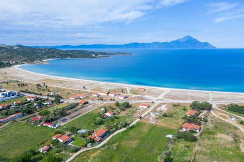 an aerial view of a beach next to a body of water at Malama Rooms in Sikia