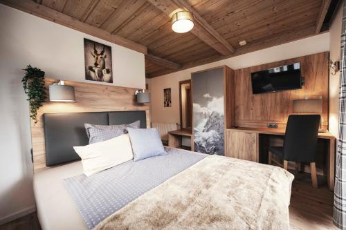 Postel nebo postele na pokoji v ubytování Golf & Ski Chalet