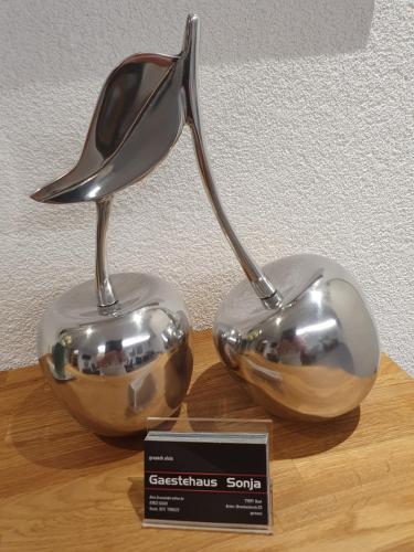 a pair of spoons sitting on top of a table at Gästehaus Sonja in Rust