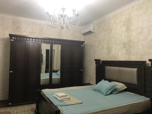 Ένα ή περισσότερα κρεβάτια σε δωμάτιο στο Real Tashkent