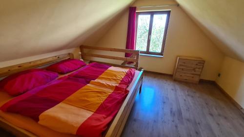 Un pat sau paturi într-o cameră la Ferien- und Erlebnishof Liepe