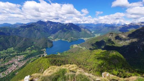 a view of a mountain valley with a lake at La mansarda di Rossella in Pieve Di Ledro