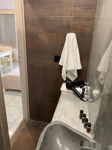 a bathroom with a sink and a shower at Argo in Skala