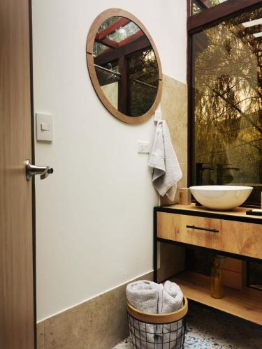a bathroom with a sink and a mirror at Glamping Cantabria in Tunja