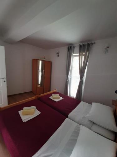 Llit o llits en una habitació de Apartments Mate