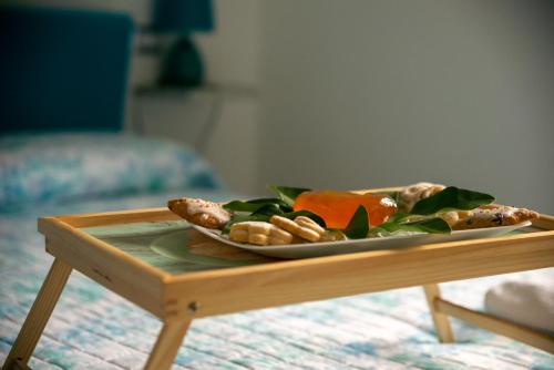 a plate of food on a tray on a table at Sisinedda in Siniscola