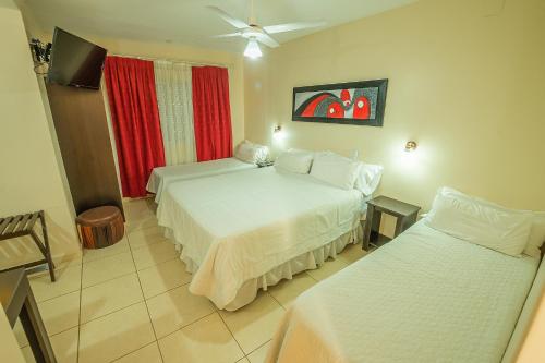 Postel nebo postele na pokoji v ubytování Apart Hotel Ayres De Termas