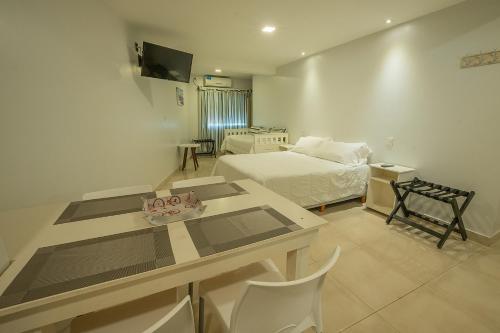 Μια τηλεόραση ή/και κέντρο ψυχαγωγίας στο Apart Hotel Ayres De Termas