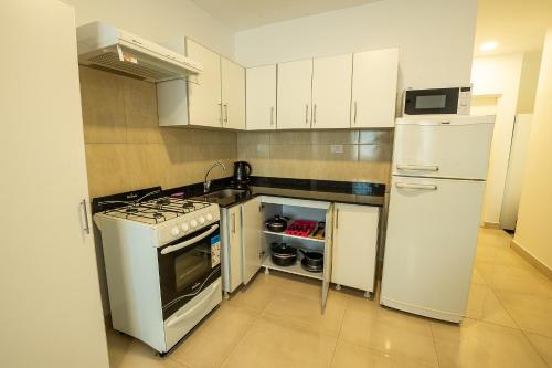 Η κουζίνα ή μικρή κουζίνα στο Apart Hotel Ayres De Termas