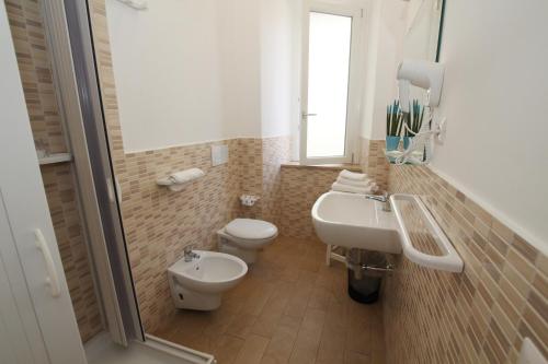 a bathroom with a toilet and a sink at Casa Calieri in Tropea