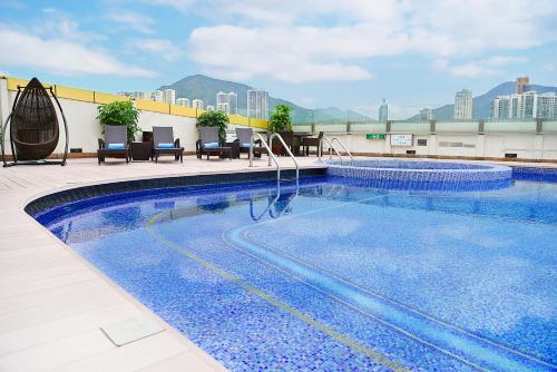 a large swimming pool on top of a building at Regal Hongkong Hotel in Hong Kong