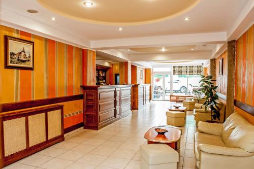 a living room with a couch and a table at Hotel Class Hermannstadt in Sibiu