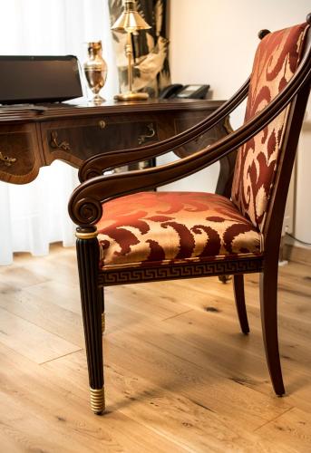 a chair at a desk with a computer at Residence Bellevue in Boppard