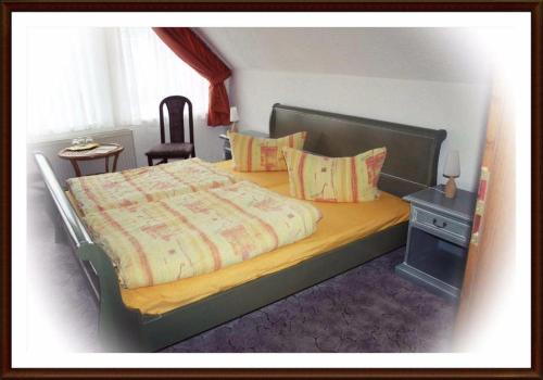 Ein Bett oder Betten in einem Zimmer der Unterkunft Kartoffelkate