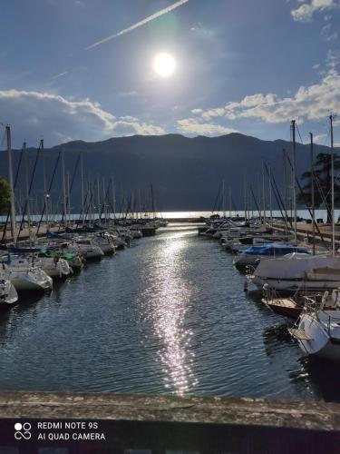 a group of boats parked in a marina with the moon in the sky at GLAM in Saint-Jean-dʼArvey