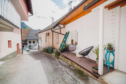 a balcony with two chairs on a building at Apartment Dajana in Bovec