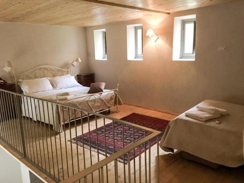 Ένα ή περισσότερα κρεβάτια σε δωμάτιο στο Relais Real Collegio