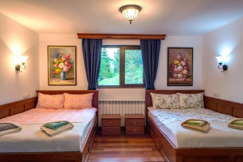 A bed or beds in a room at Stoykite-Pamporovo Nature Retreat