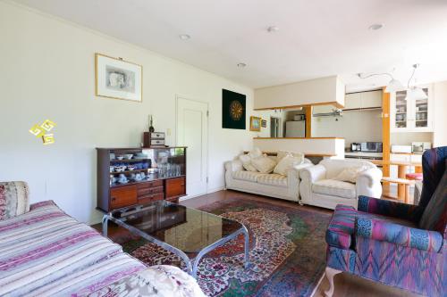 a living room with a couch and a coffee table at Hakone Villa in Hakone