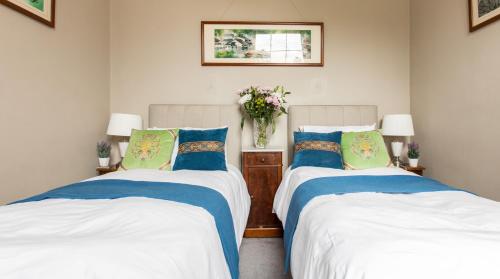 En eller flere senge i et værelse på Flat 3, 6 Lypiatt Terrace Cheltenham Gloucestershire GL50 2SX