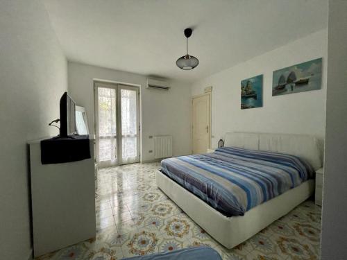 Ένα ή περισσότερα κρεβάτια σε δωμάτιο στο Casa Di Nicola