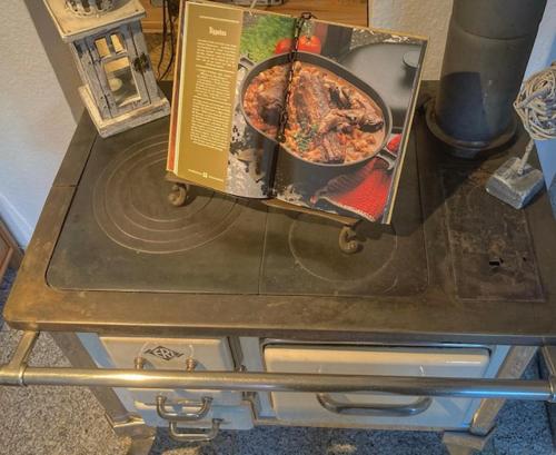 a table with a pizza in a box on it at Ferienwohnung schöner Rheingau in Bad Schwalbach