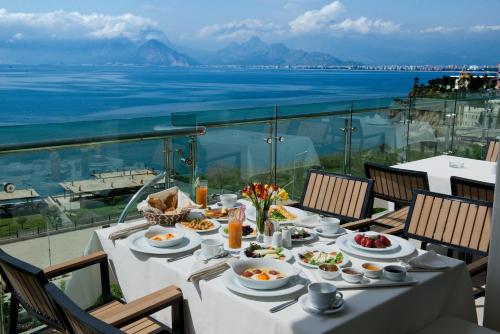 a table with food on it with a view of the ocean at Prime Boutique Hotel in Antalya